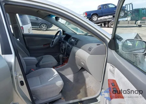 2003 Toyota Corolla Le z USA, uszkodzony, nr VIN JTDBR32E830020266